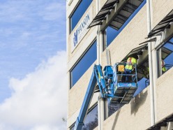 Hanson Outside with worker fixing the glass